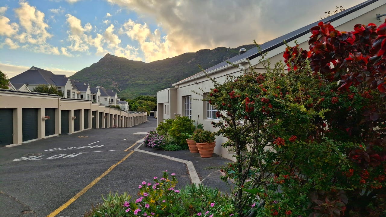 The Spinney village with mountain backdrop and bougainvillea